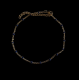 Chaîne de cheville dorée à perles bleu marine