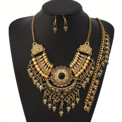 Collier oriental doré à pierres noires avec boucles assorties