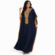 Djellaba femme pompons bleu marine à la coupe fluide et confortable.
