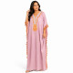 Djellaba femme pompons rose poudré au style oriental élégant.