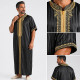 Qamis homme satiné noir à col droit avec broderies dorées