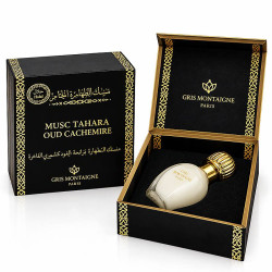 Musc Tahara Oud Cachemire Gris Montaigne 12 ml, flacon blanc au bouchon doré présenté dans son coffret noir et or ouvert